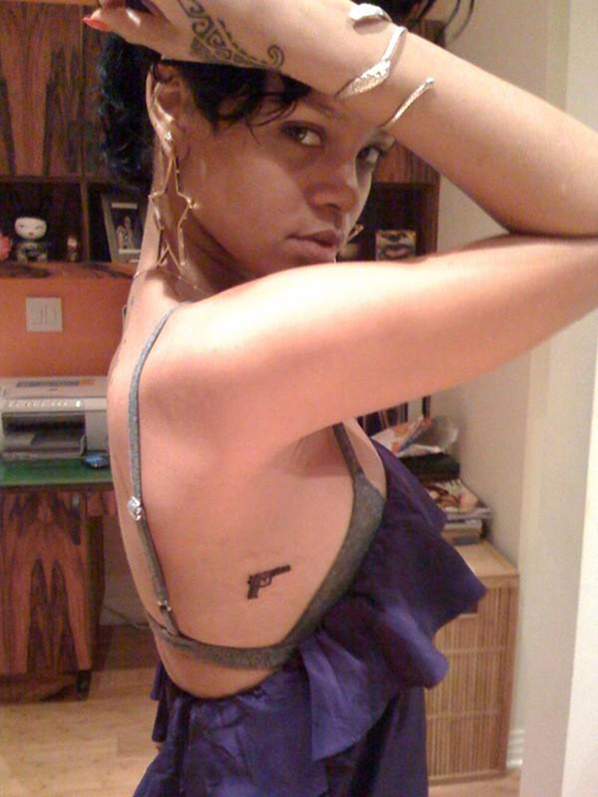Rihanna Covered In Gun Tattoos.
