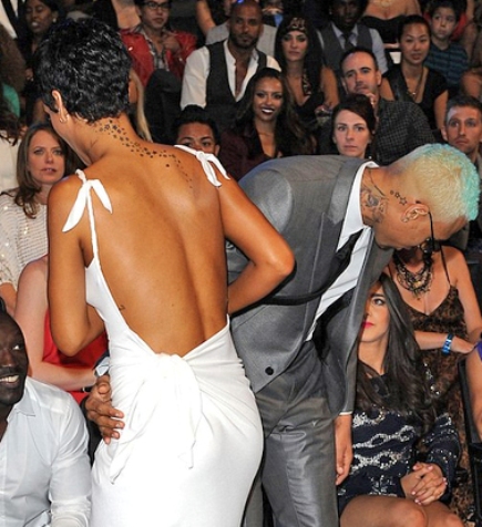 rihanna and chris brown lock lips again, back following each