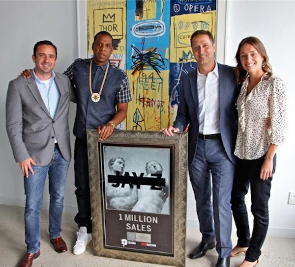 Jay-Z with platinum plaque