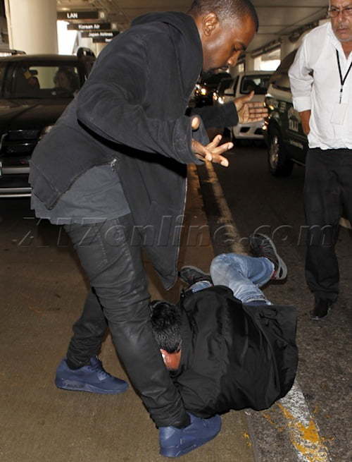 Kanye West calmly man-handles a paparazzi