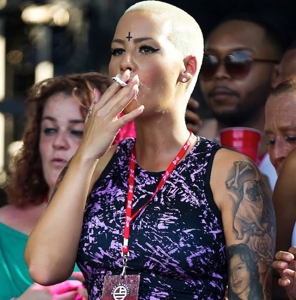 Amber Rose inverted cross tattoo