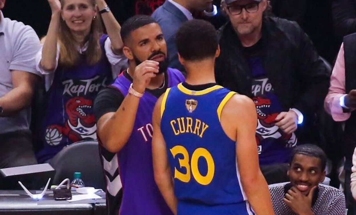 Drake Trolls Steph Curry At NBA Finals, Wears Father's Raptors Jersey &  Says He Has Curry's Hair Lint For Sale - theJasmineBRAND